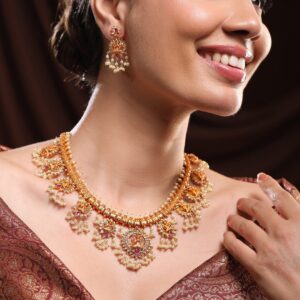 24K Gold-Plated Lakshmi Temple Necklace Set with Ruby Stones & Pearl Detailing - Gold