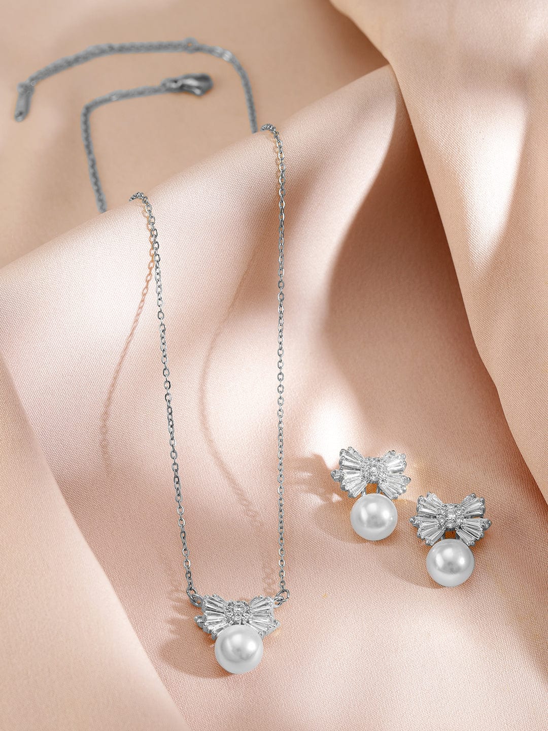 rubans-rhodium-plated-pearl-and-crystal-bow-pendant-necklace-and-earrings-necklace-chain-1143856227.jpg